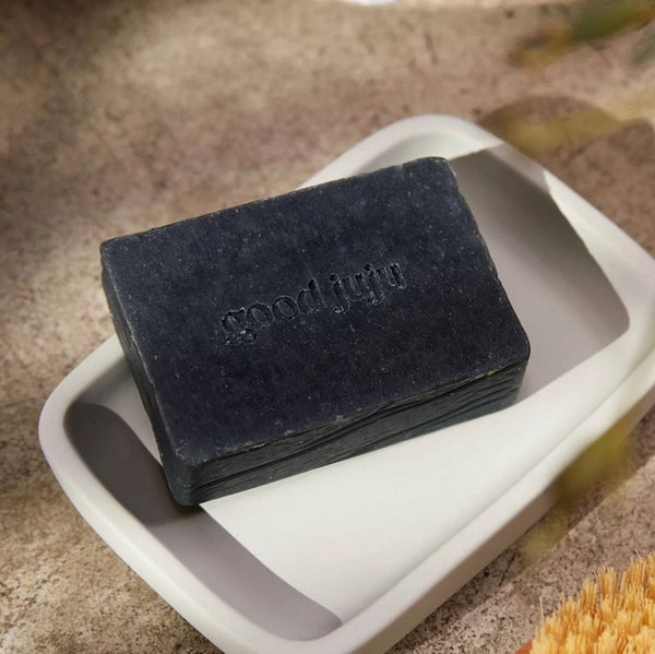 Canadian made Good Juju lavender cedarwood rosemary scented body wash bar made with activated charcoal that gently removes any impurities, while your skin soaks up all the moisturizing goodness of coconut, olive, and avocado oils