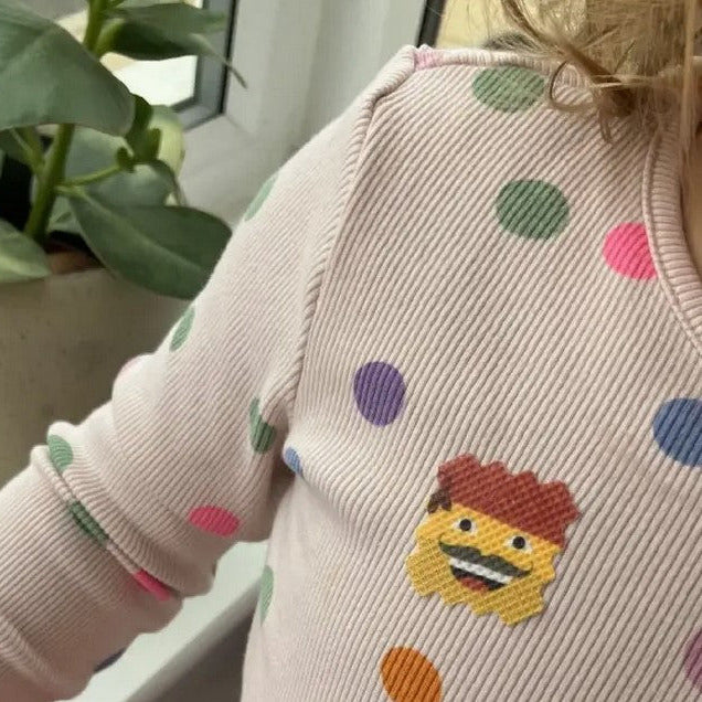 Child wearing NATPAT AllergyPatch allergy relief sticker on clothing for safe, natural seasonal allergy support.