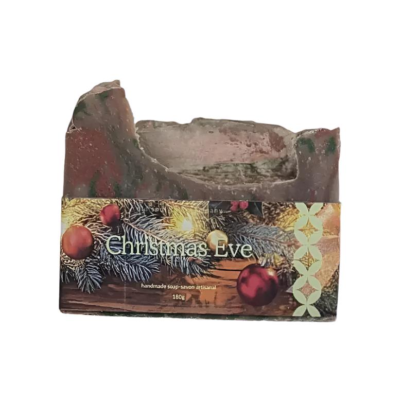 Artisan top 180 g seasonally scented bar soap with a photo label with the words Christmas Eve on a white background.