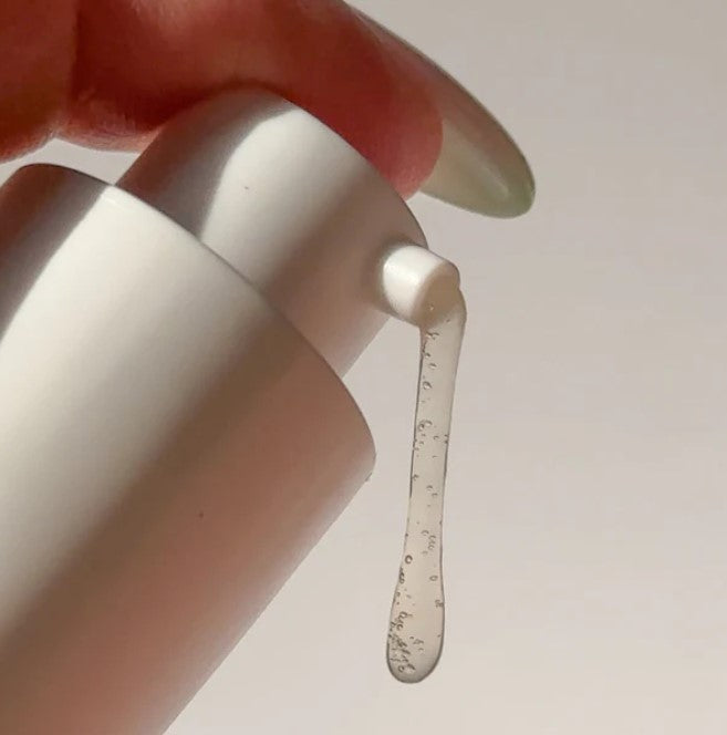 Clear view of Freshen Up Facial Cleansing Gel tube displaying scent notes and 150ml volume on textured surface