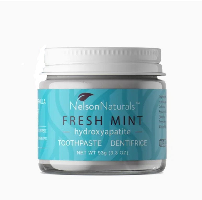 Canadian made fresh mint hydroxyapatite toothpaste by Nelson Naturals in a clear 93 g/3.3 oz glass jar with white lid. Shown pictured on a white background.