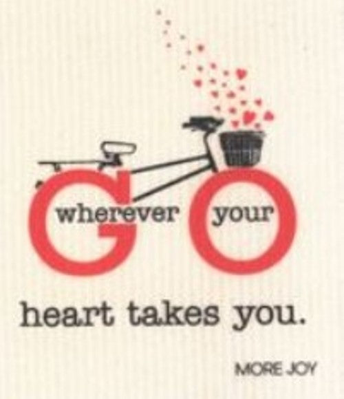 Compostable eco sponge cloth made of cellulose and featuring a bicycle with the inspiring message 'go wherever your heart takes you,' replaces paper towel by absorbing 20x its weight in liquid. Size 20 x 17 cm