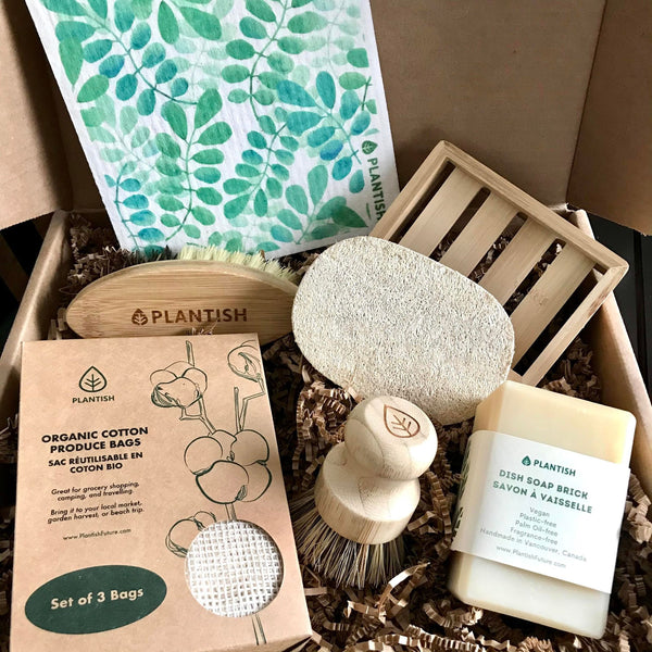 This zero waste Plantish kitchen gift set includes a Swedish dish cloth, a bamboo soap dish, a vegetable brush, a loofah dishwashing sponge, a set of three organic cotton produce bags, a pot scrubber and dish soap bar (unscented 13 oz).