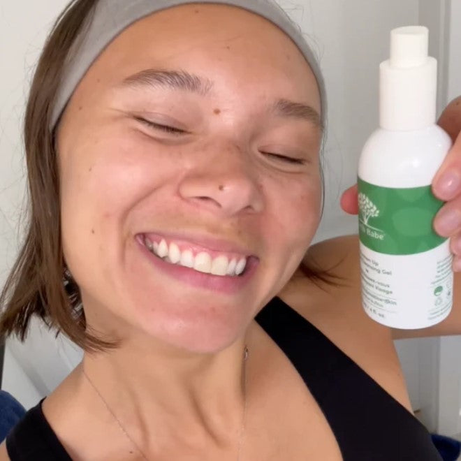 Close-up of Freshen Up Facial Cleansing Gel tube’s textured label and vibrant scent notes on the cap, highlighting packaging