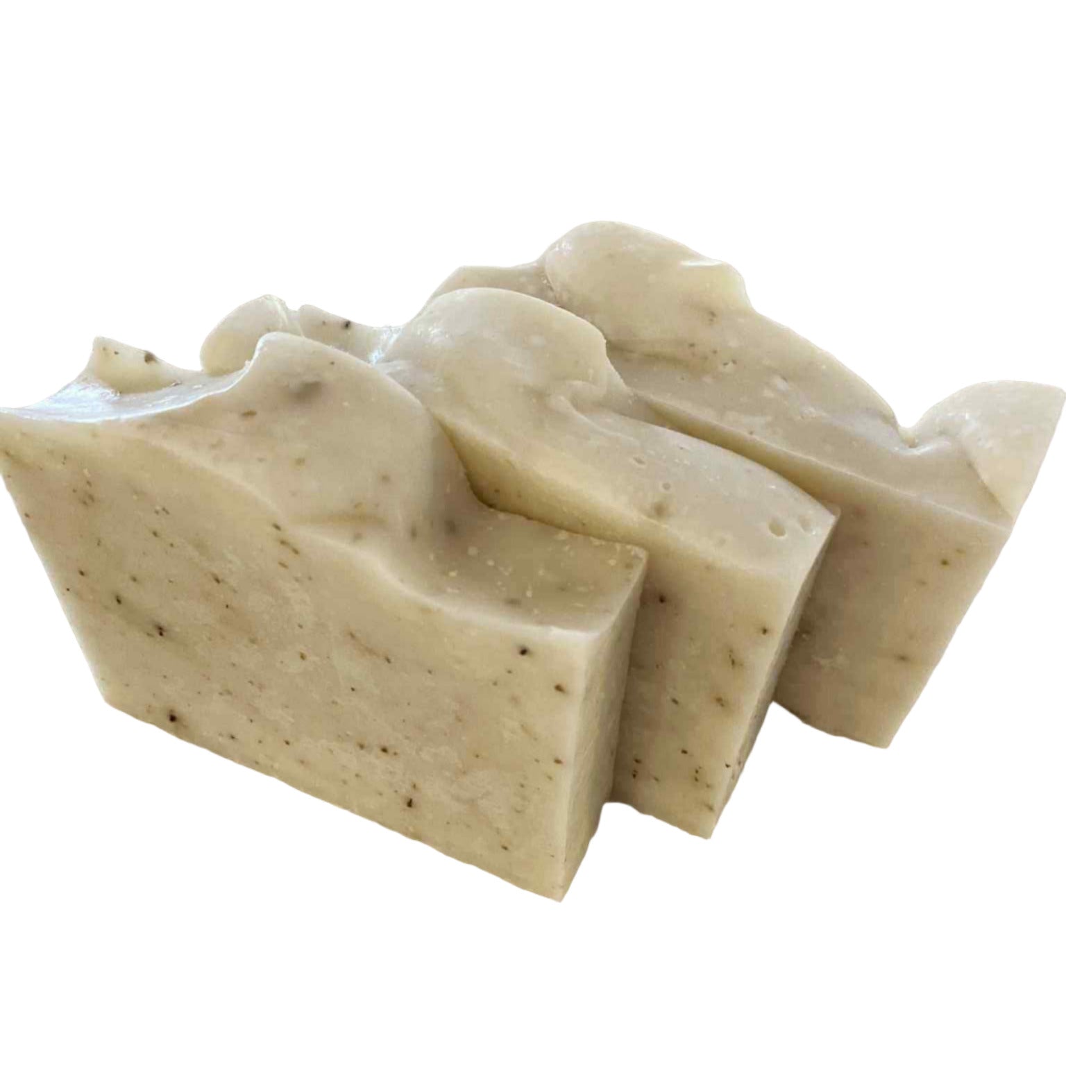 Three beige soap bars stacked on a white background