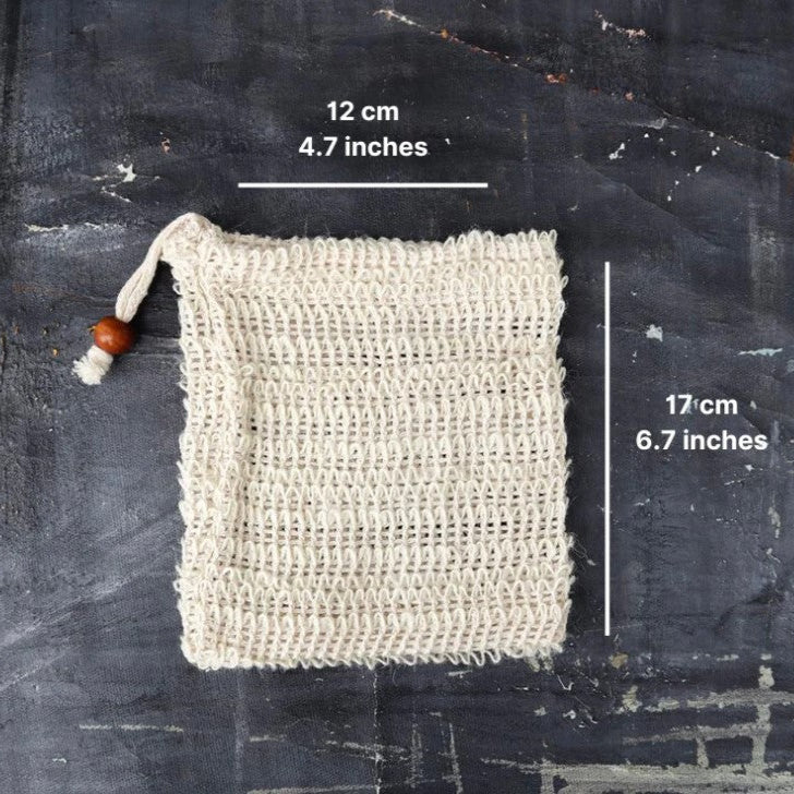 A sisal soap bag with the measurements of 12 cm (4.7 inches) and 16 cm (6.7 inches) printed on the side.