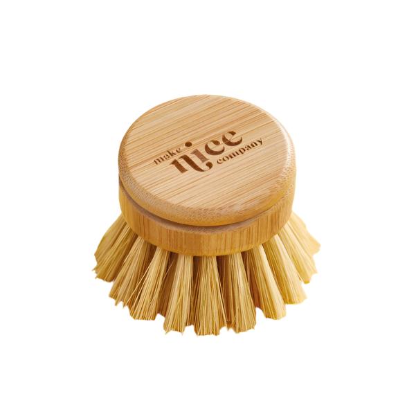 Make Nice Company dish brush head on a white background. The bristles of this replacement head brush for the make nice dish soap kitchen brush are made of Tampico (from the Agave plant) and the handle is made of beechwood and metal.