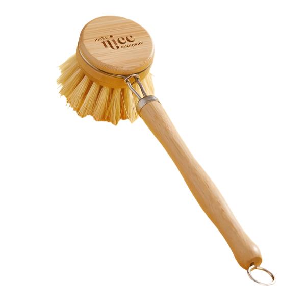 Make Nice Company dish brush on a white background. This biodegradable wooden kitchen brush with replaceable head can easily maneuver to wash the inside of your jars or other reusable drink containers. Replacement heads sold separately.