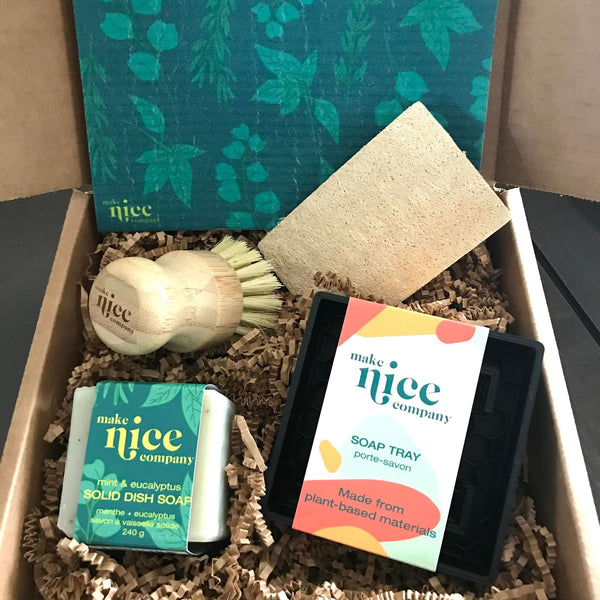 Mint and eucalyptus dish soap bar eco gift set made in Canada by the Make Nice Company includes a sponge cloth, a solid dish soap cube, a pot scrubber, a plant-based soap tray and an expandable loofah sponge