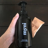 myni black foaming hand soap 500 ml glass bottle with white lettering and an individual foaming hand soap tablet