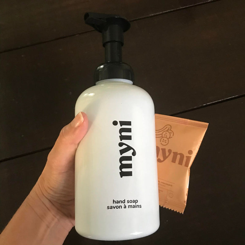 myni white foaming hand soap 500 ml glass bottle with black lettering and an individual foaming hand soap tablet 