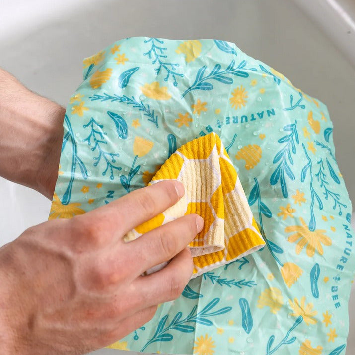 Once you're done using your Canadian made beeswax food wrap, you can wash it and reuse it over and over again! Hand wash with cold soapy water and give it a gentle scrub with a washcloth to wash away any stubborn food residue. Lay or hang your wrap out to dry, and store in a cool dry place until you use your wrap again.