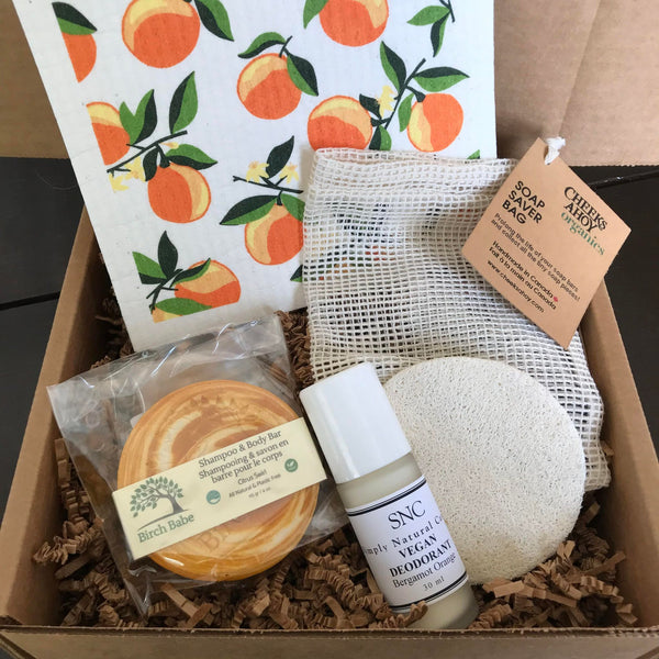 This citrus themed Orange Blossom Gift Set features some of our favourite sustainable products a Citrus Swirl Shampoo & Body Bar from Birch Babe, an 'Orange Blossom' Swedish Cloth from Ten and Co., a Soap Saver Bag from Cheeks Ahoy, a expandable Loofah Slice sponge, and a SNC Bergamot Orange refillable roll on deodorant packaged in a gift box.