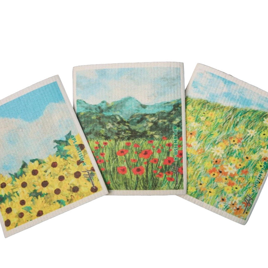 Picturesque Artistry Swedish Sponge Cloth Set by Plantish – eco-friendly compostable dishcloths featuring artistic floral landscape designs with sunflowers, poppies, and daisies on a