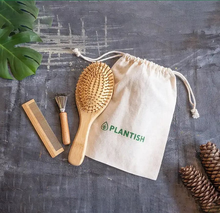 Plantish Bamboo Hair Brush Set with comb, brush cleaner, and reusable cotton bag on grey background – sustainable Canadian hair care essentials.