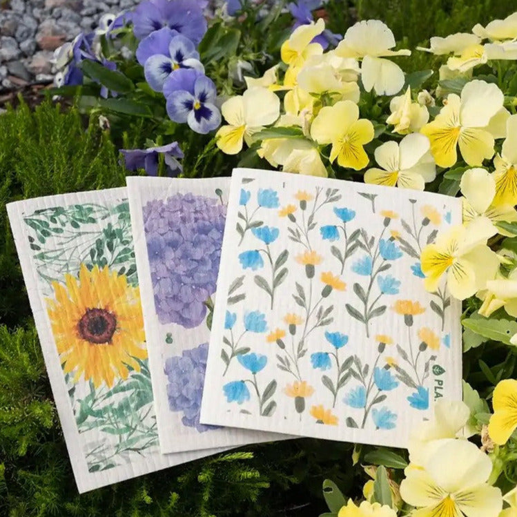 Introducing the Floral Bursts Swedish Sponge Cloth set in sunflower, aster and hydrangea motifs by the Canadian brand Plantish inspired by flowers, their vibrance and chemistry in bloom. 