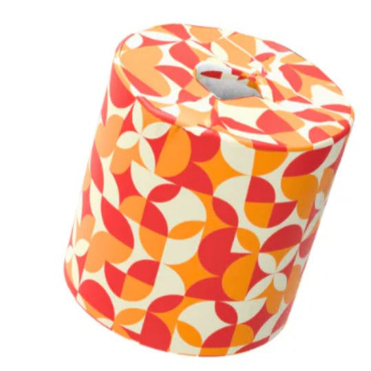 Eco-friendly bamboo toilet paper roll wrapped in retro red, orange, and cream geometric pattern – sustainable and plastic-free.