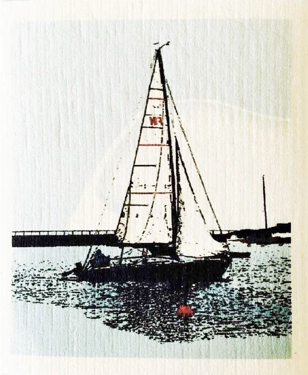 Compostable eco sponge cloth made of cellulose and featuring a beautifully-manipulated photograph of a lone sailboat, black-on-white with a splash of colour, replaces paper towel by absorbing 20x its weight in liquid. Size 20 x 17 cm