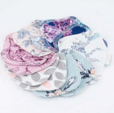 Set of 12 reusable cotton facial rounds in assorted spring floral prints by Cheeks Ahoy, handmade in Canada and designed for zero-waste skincare routines.