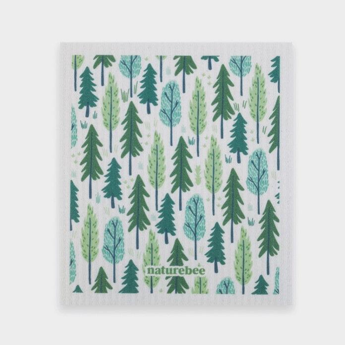 Swedish dishcloth in a pattern of trees on a white background by Nature Bee replaces 17 paper towel rolls and absorbs up to 20x its weight in liquid