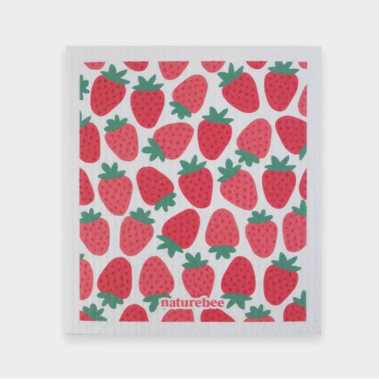 Swedish dishcloth in a pattern of strawberries on a white background by Nature Bee replaces 17 paper towel rolls and absorbs up to 20x its weight in liquid