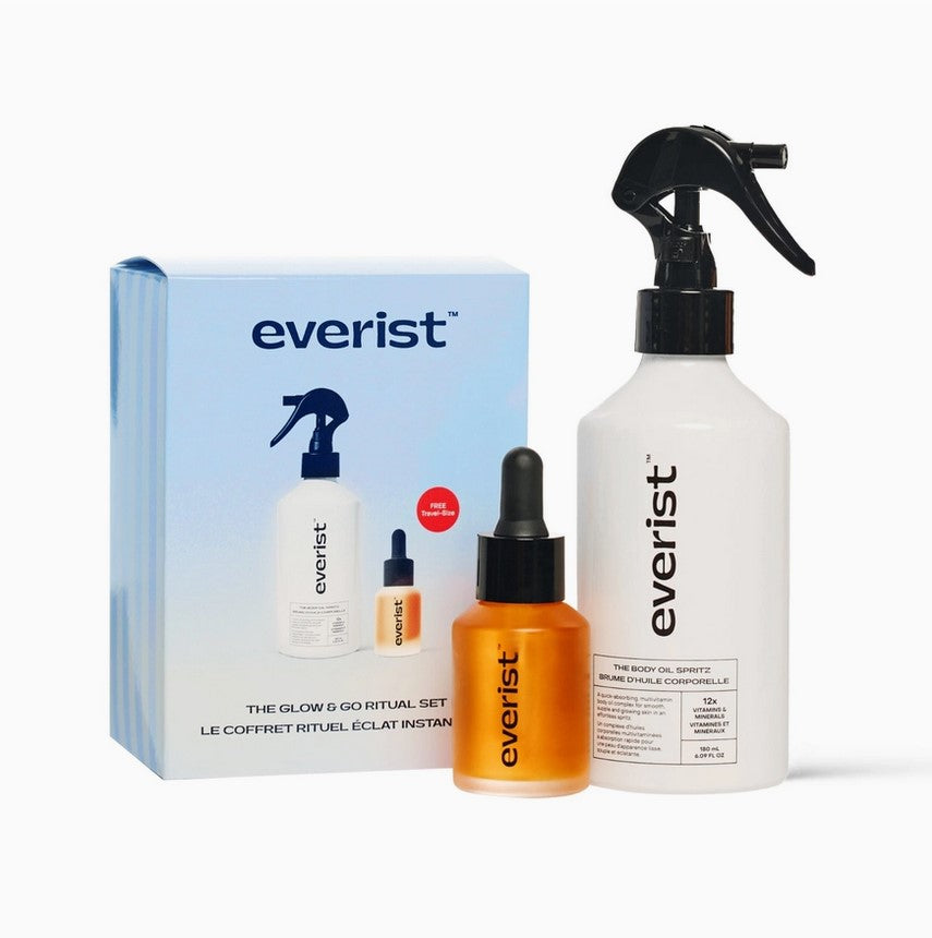 Everist Go & Glow Ritual Set with clear glass bottles, exfoliating body scrub, and natural wooden accessories in neutral