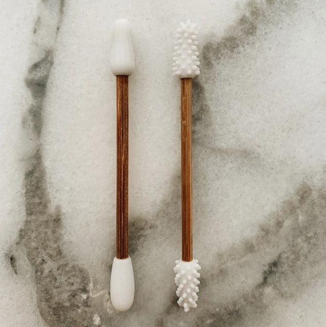 Close-up of bamboo head and silicone tip showcasing textured surface for gentle cleaning in reusable silicone and bamboo