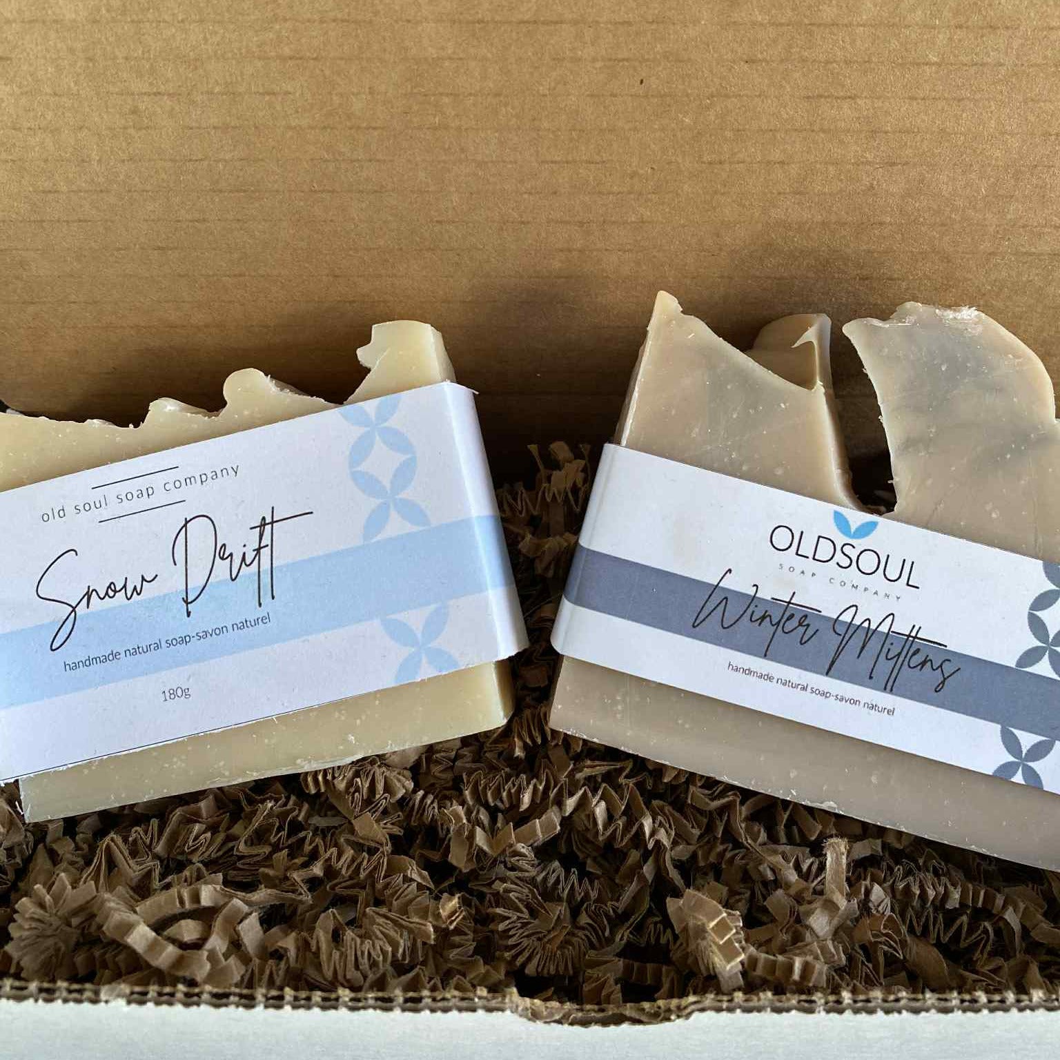 Winter Snow Soap Gift Set featuring four rectangular bar soaps with textured white, pale blue, and soft gray swirls, wrapped