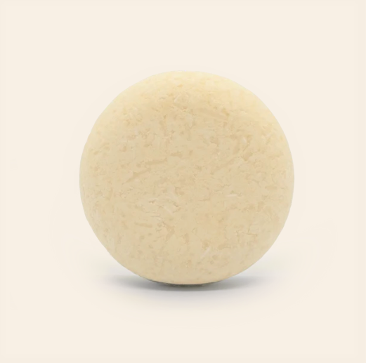 Unpackaged orange patchouli scented shampoo bar for dry curly hair made in Canada by good juju