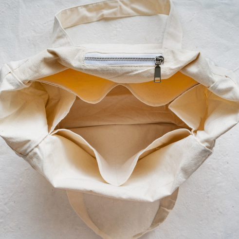 With side panels, pockets, and empty room, your groceries will be stored safely and securely in this Plantish organic cotton canvas tote bag.