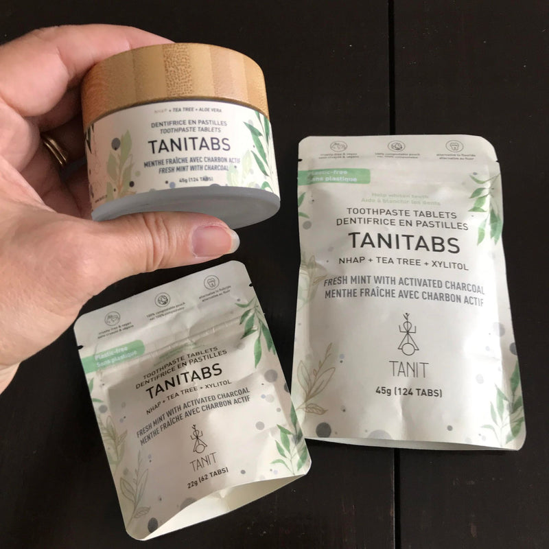 Fresh mint activated charcoal toothpaste tablets available in a 45 g glass jar (124 tablets)  as well as compostable pouches of either 62 or 124 tablets made in Canada by Tanit