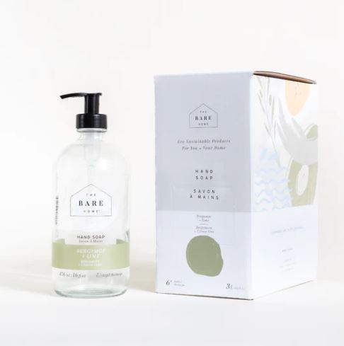 Bergamot lime essential oil scented natural hand soap in a 476 ml refillable glass pump bottle sits alongside a 3 L at home refill box both of which are made in Canada by The Bare Home company based in Ontario