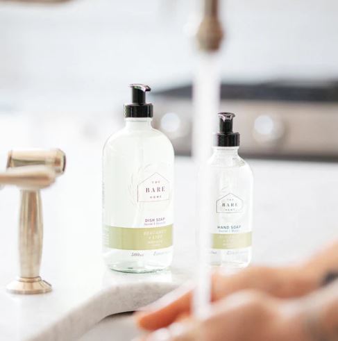 bergamot lime essential oil scented natural hand soap sits beside a larger dish soap bottle of the same scent (sold separately) made in canada by the bare home company based in ontario