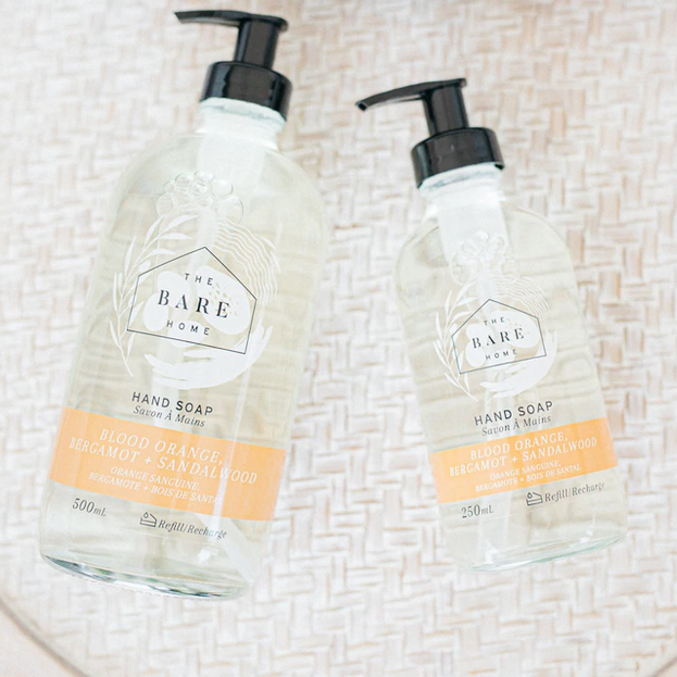 Blood Orange, Bergamot Lime and Sandalwood essential oil scented natural hand soap in a 476 ml and 236 ml refillable glass pump bottles made in Canada by The Bare Home company based in Ontario