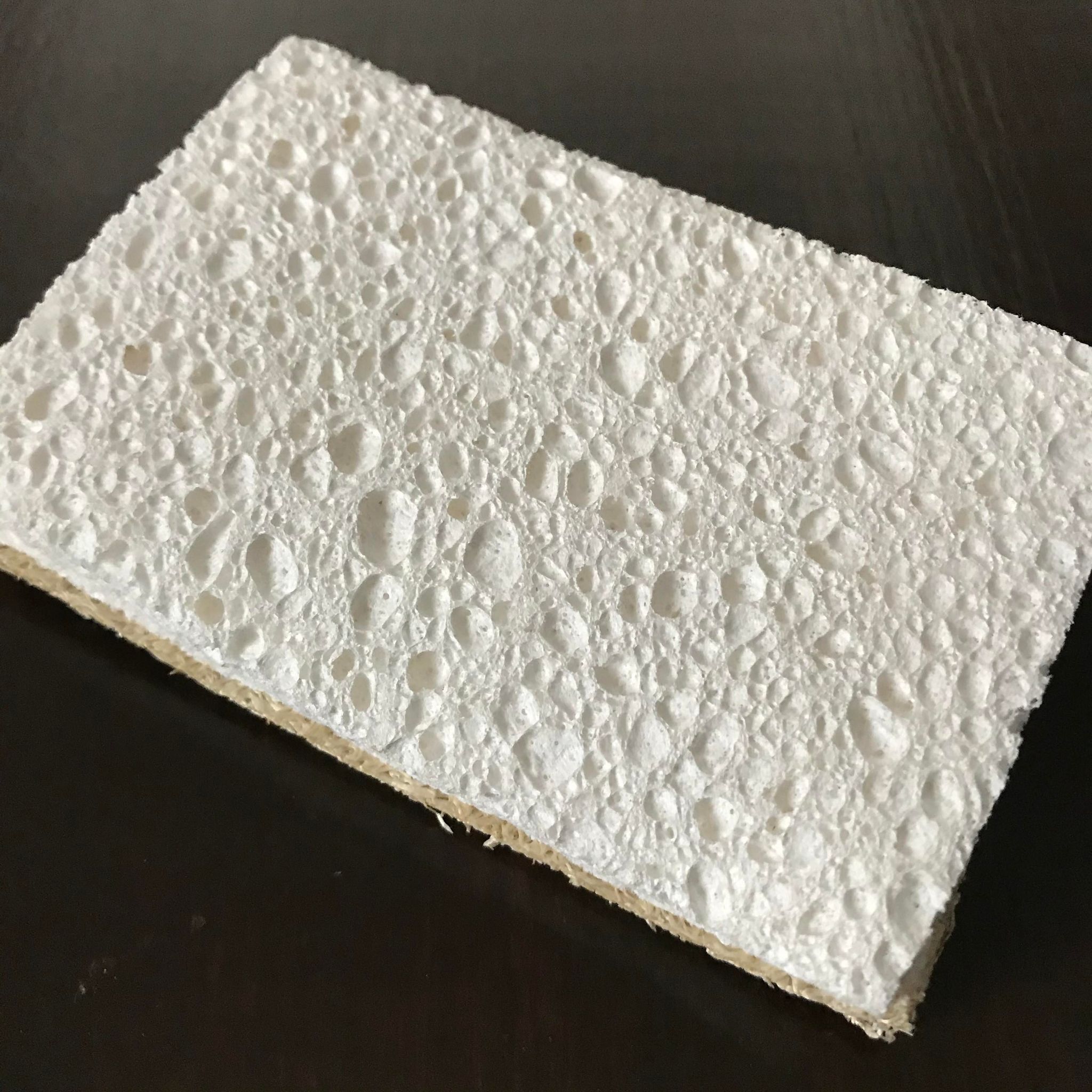 The white part of this compostable sponge is spongy and absorbent, made of wood pulp while the yellow-brown part is scrubby and helps soap become sudsy, made of loofah
