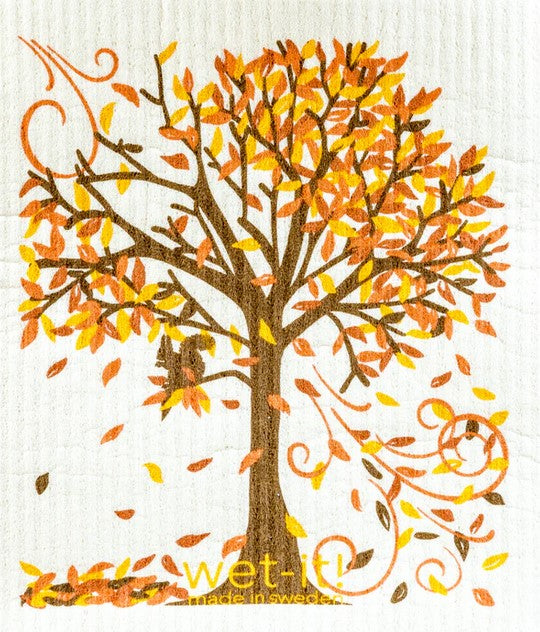 Autumn themed Swedish sponge cloth with coloured leaves falling from a tree made in sweden by wet it!