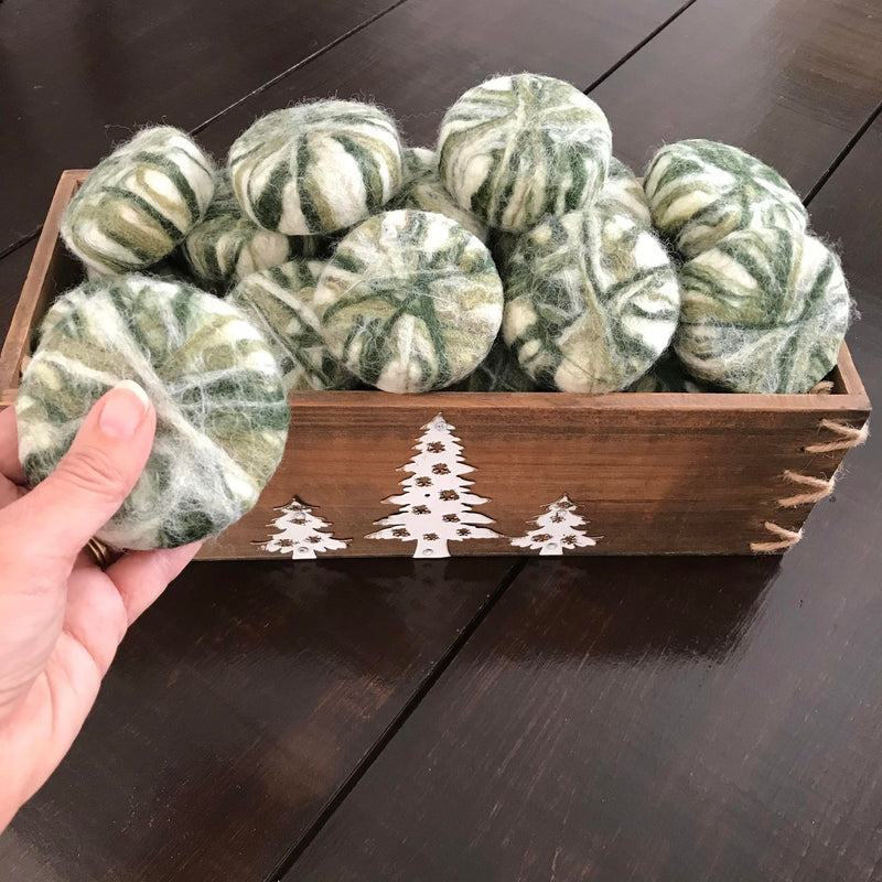 Wooden crate  full of canadian made cedar sage essential oil simply natural canada round soaps hand felted in winter green shades using 100 per cent wool 