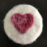 cranberry wine handcrafted round soap hand felted with a multi-shaded red heart on white background made in canada by simply natural canada