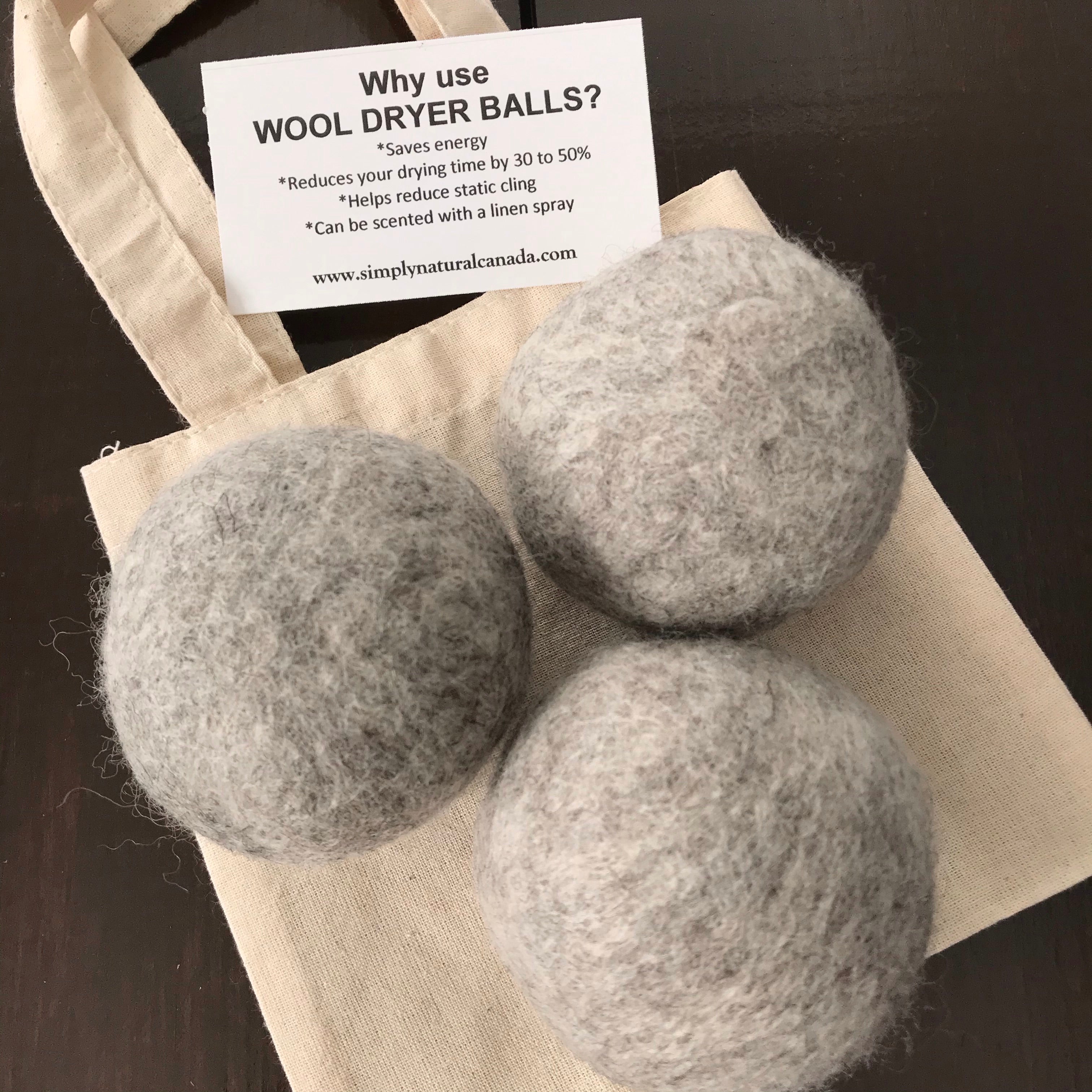 set of 3 canadian made grey 100 percent wool dryer balls sold in a cloth bag