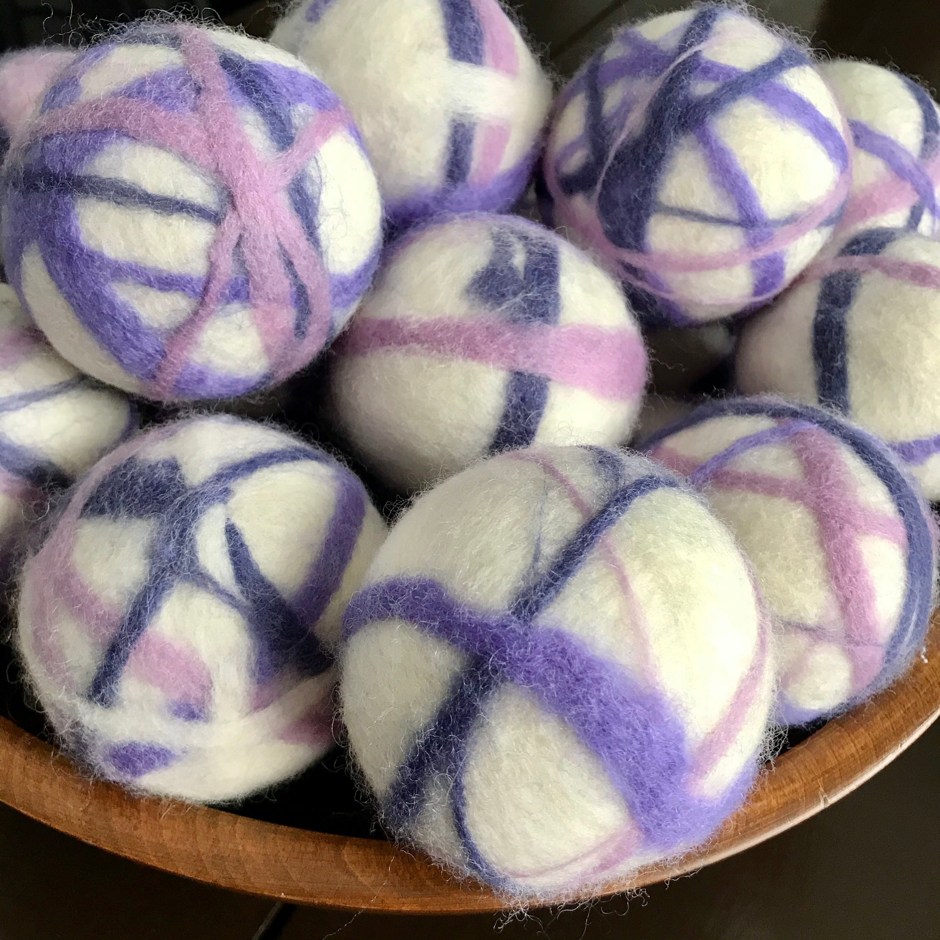 large canadian made white, purple and pink 100 percent wool dryer balls sold individually or in a set of 3 in a cloth bag