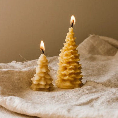 Set of two pure 100 per cent beeswax Christmas tree candles in an printed organic cotton gift bag handcrafted in Ireland by Goldrick Natural Living