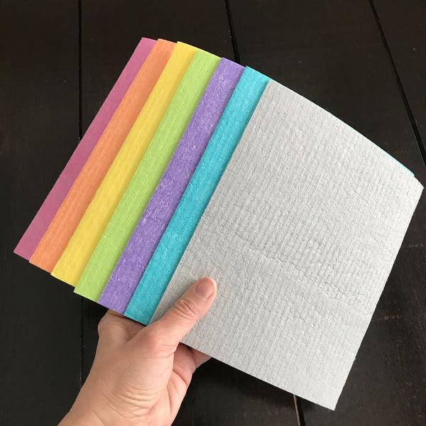 solid color swedish cloths in pink orange green purple teal and grey made by more joy to replace paper towels and absortb 20x their weight