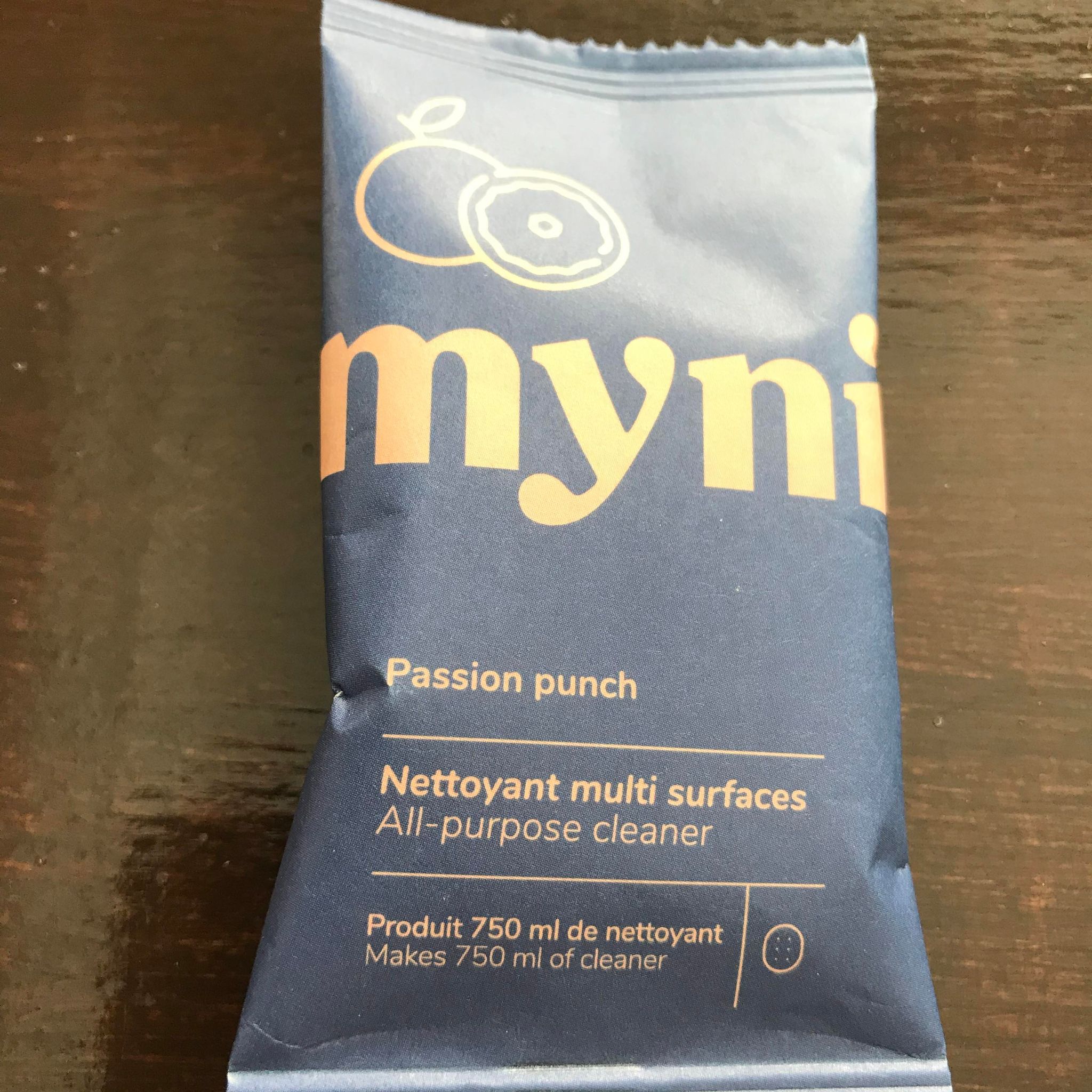 Passion punch grapefruit and mango scented all purpose cleaning tablet in compostable packaging made in canada by myni