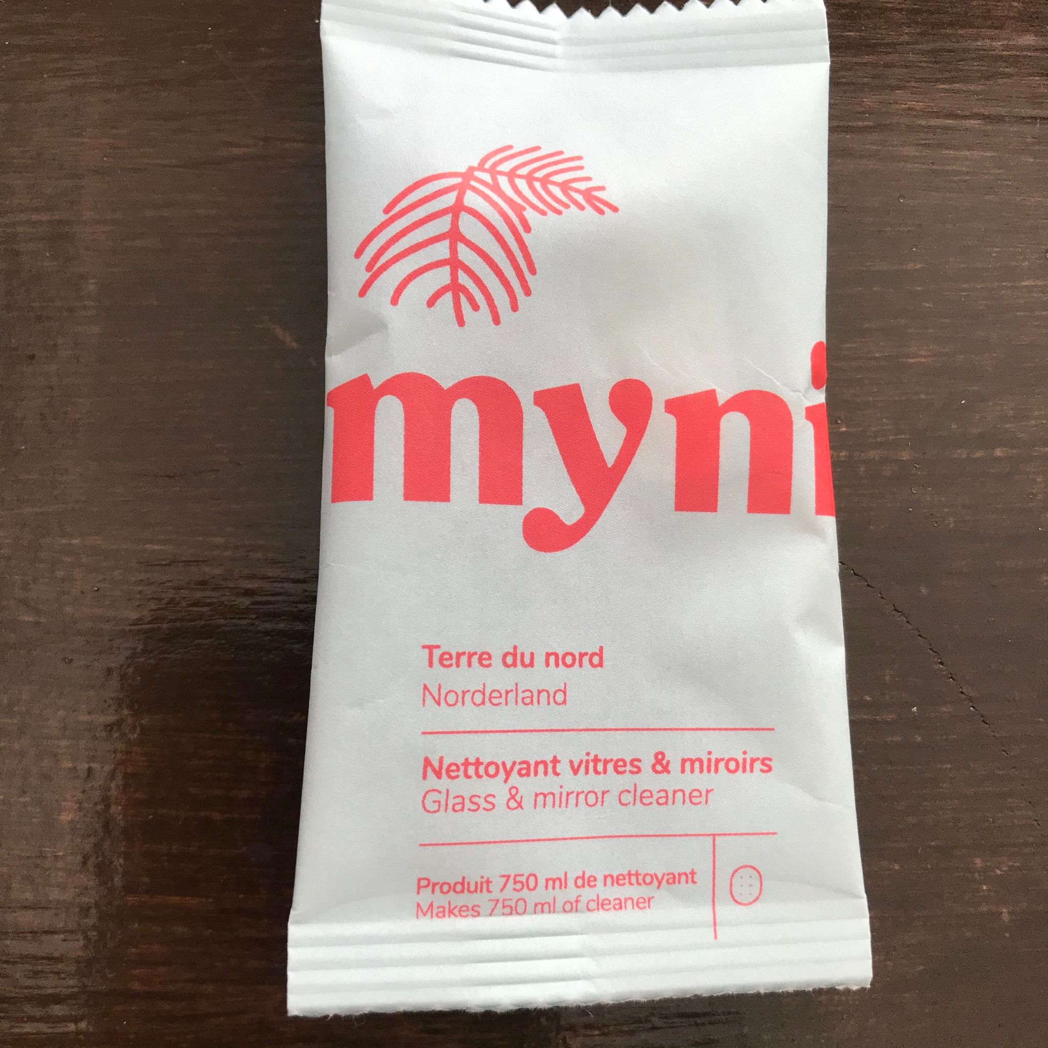 Norderland black spruce scented glass and mirror cleaner cleaning tablet concentrate in a compostable pouch made in canada by myni