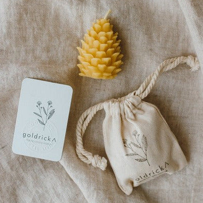 Beautiful petite pinecone candle in a organic cotton gift bag handcrafted with pure local beeswax by Goldrick Natural Living