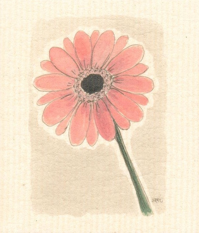 ellulose/cotton composatable more joy swedish sponge cloth with a single pink gerbera daisy on a white background 6.7" x 7.9"