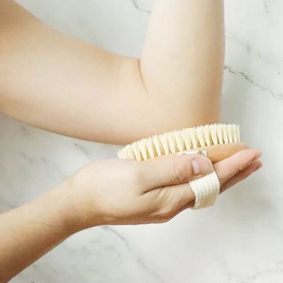 how to use a dry body brush on your elbows