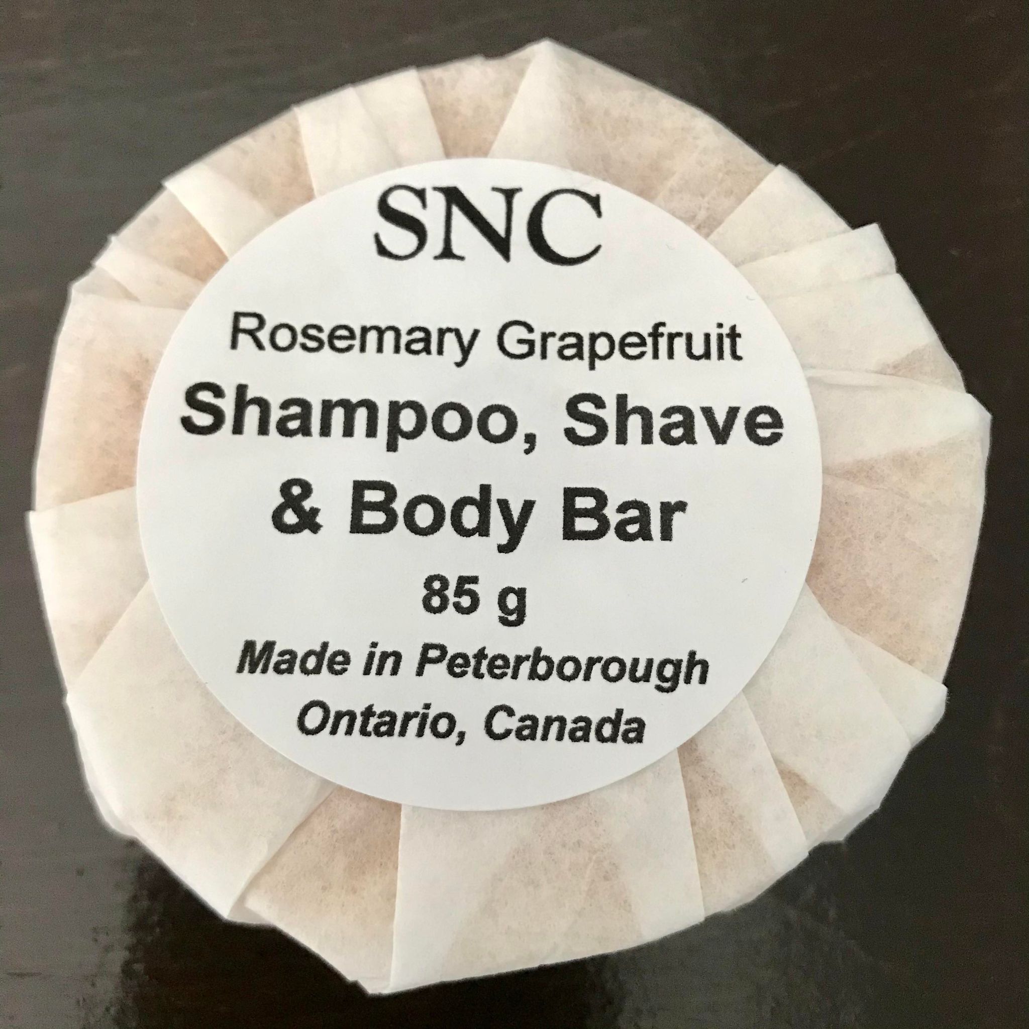 natural rosemary grapefruit essential oil scented round shampoo, shave and body bar made in Canada by Simply Natural Canada