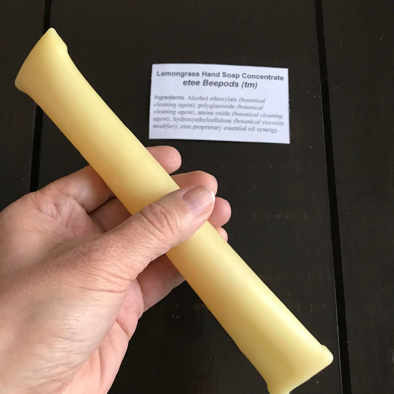 Dish soap concentrate in lemongrass essential oil scent packaged in a compostable beeswax pod make in Canada by etee sold individually and in packages of 3