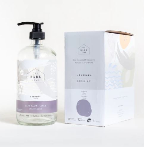 Lavender sage essential oil scented natural liquid laundry detergent in a 946 ml refillable glass bottle sits alongside a 3 L at home refill box both of which are made in Canada by The Bare Home company based in Ontario